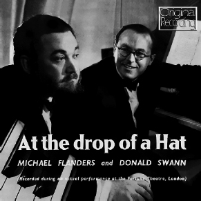 Start of image description, The record cover of the live recording of the musical revue, At the Drop of a Hat, by the comedy duo, Michael Flanders and Donald Swann. Flanders and Swann are pictured sitting at a piano. The performance was recorded at the Fortune Theatre in London in 1957., end of image description