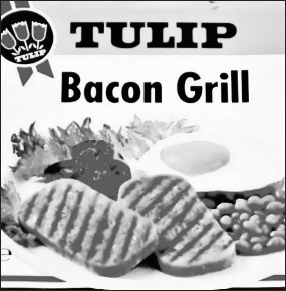 Start of image description, A can of Tulip Bacon Grill. Danish-made Bacon Grill is a cured chopped pork product with a smoky flavour, and the image on the front of the can shows slices of Bacon Grill with a fried egg, baked beans, fried tomatoes, and some lettuce., end of image description
