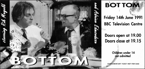 Start of image description, A complimentary ticket for the live recording of an episode of Bottom at B B C Television Centre on 14 June 1991. The ticket features an image of Adrian and Rik playing the characters, Edward Elizabeth Hitler, known as Eddie, and Richard Richard, known as Richie. They are seated at the kitchen table and Richie is staring suspiciously at a piece of food on the fork that Eddie is offering to him., end of image description