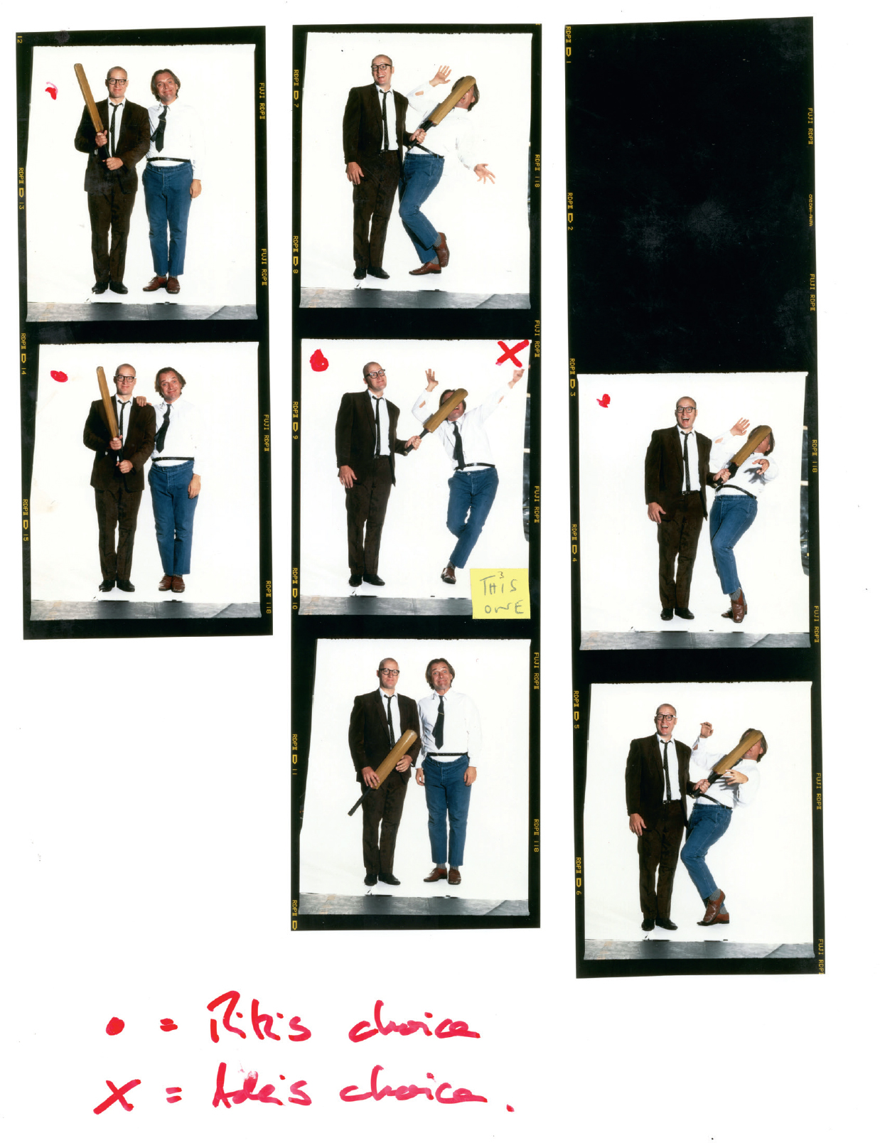 Start of image description, A sequence of 7 publicity stills for the Bottom Live tour. Each photo features a version of Adrian either holding the cricket bat, or hitting Rik in the face with it. Rik has marked his 4 preferences with a red dot. Adrian has marked his choice with a red cross. A small sticky note says, This one. The chosen image features Adrian casually smacking Rik in the face with the bat and Rik throwing his arms up as he falls backwards., end of image description